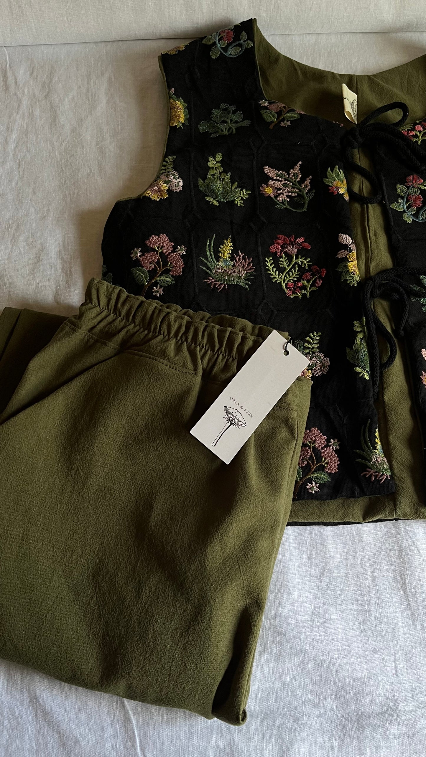 Embroidered tie front vest