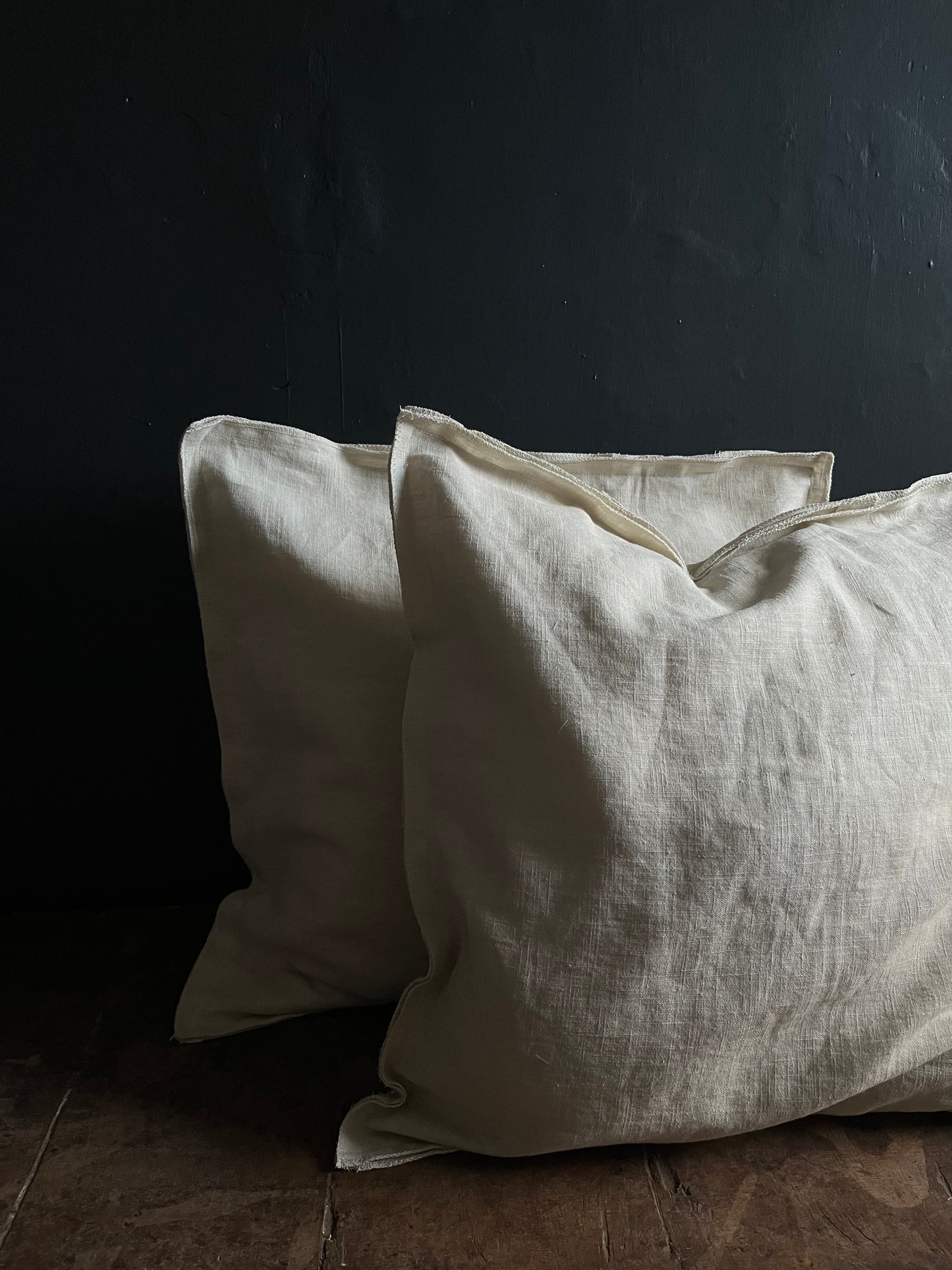 Textured washed linen serged edge cushion