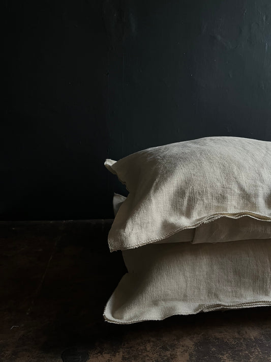Textured washed linen serged edge cushion